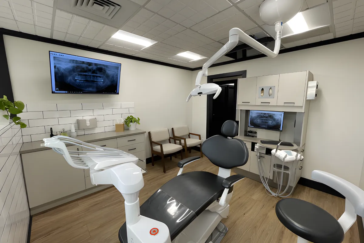 Treatment room with a patient chair and x-ray screen at Hill Family Dental in Orem